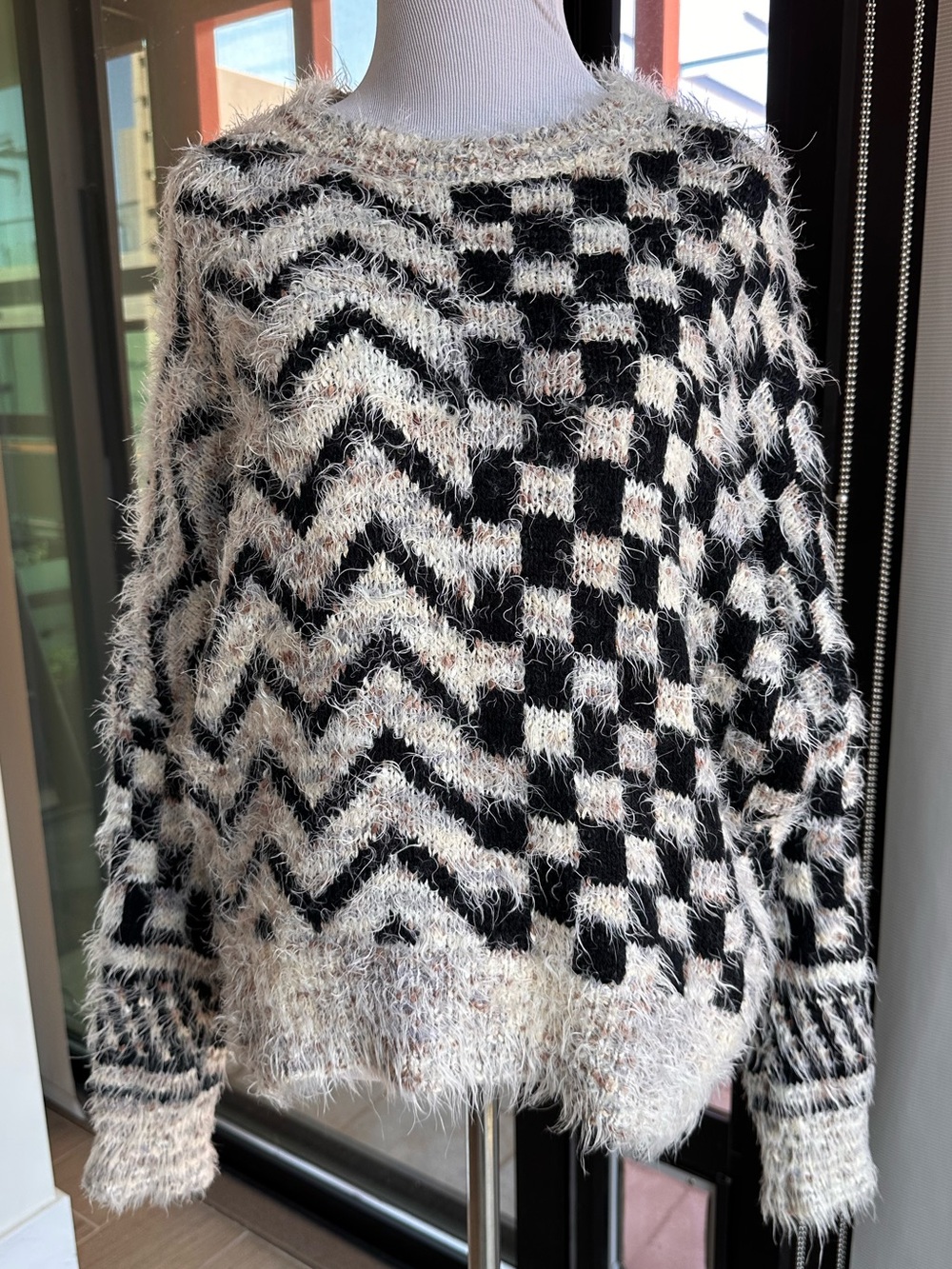 AKIRA Chicago Black and Cream Fuzzy Checker & Chevron Sweater